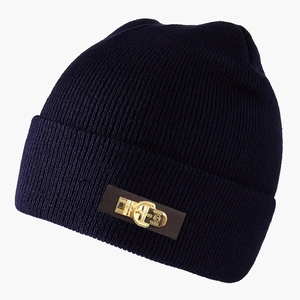 Deep blue ribbed knit beanie with a brown leather patch and a gold 1999 engraved buckle