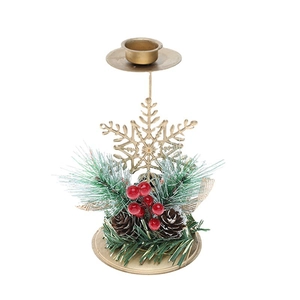 Golden Christmas candle holder with pine cones and red berries on a white background