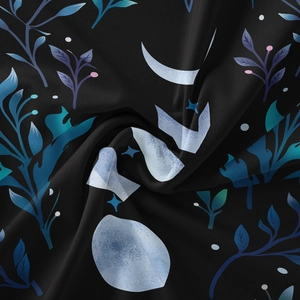 Detailed close-up of soft bohemian tapestry fabric with blue floral moon pattern