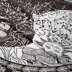 Close-up of bohemian sun and vine patterns on high-quality cotton linen fabric texture