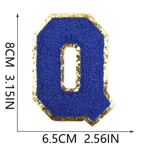 Detail of royal blue chenille letter Q patch with gold glitter edge and 8cm measurements