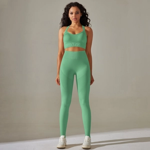 Detail of mint green seamless yoga set with ribbed waistband and high-stretch fabric texture