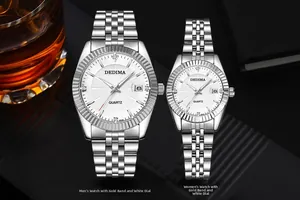 Close-up of luxury couple watches with silver metal straps and white sunray dials