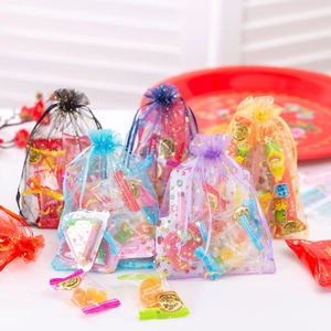 Star and moon gold foil mesh gift bags filled with assorted colorful holiday candies