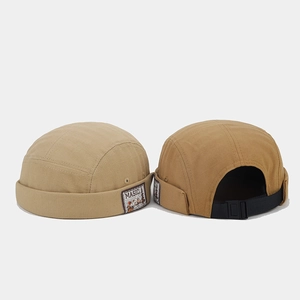 Detail of vintage canvas brimless docker hats with Masic patch and adjustable straps
