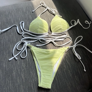 Sexy neon green textured bikini set with silver heart rings and adjustable ties