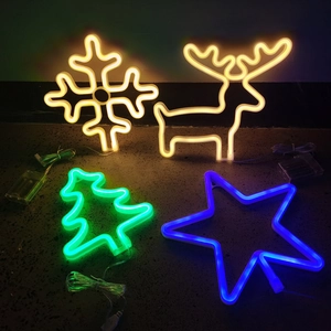 Neon LED Christmas lights in snowflake, deer, tree, and star shapes for wall decor