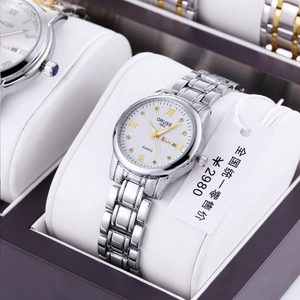 Detail of ORUSS 1853 quartz watch featuring dual calendar and luxury crystal markers