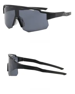 Detail view of matte black frame and large shield lenses on professional cycling glasses