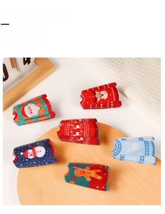 Detailed set of six Christmas hair claw clips with santa and reindeer sweater patterns