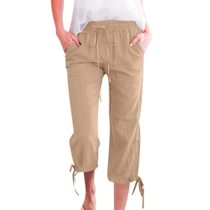 Detail of khaki cotton linen pants showing the drawstring elastic waist and side pockets