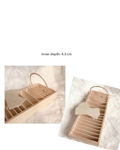 Detailed view of wooden headband display rack with 4.5cm deep slots for jewelry storage