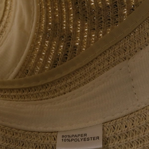 Detail view of the inner sweatband and fiber material label showing 90% paper 10% polyester