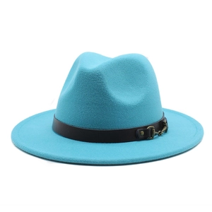 Detail of teal wool fedora hat featuring a brown leather band and antique metal buckle