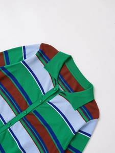 Close-up of multicolored striped knit polo shirt featuring green collar and button detail