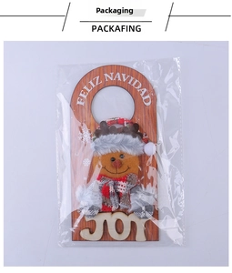 Detailed view of Christmas reindeer door hanger with JOY sign in clear packaging