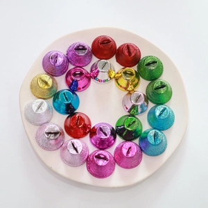 Frosted vacuum-plated 26mm colorful metal bells displayed in a circular arrangement on a plate