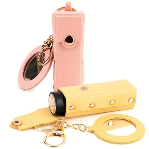 Portable pink and yellow leather lipstick cases with keychains and mini mirrors