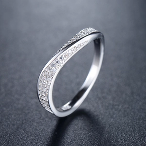 Irregular wave S925 sterling silver ring with micro-pave cubic zirconia on black surface