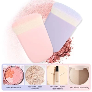Detail of pink and purple makeup brushes with soft dense bristles for blush and powder