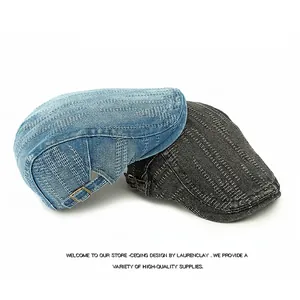 Washed denim flat caps in navy blue and dark grey with vertical stitching and metal buckle