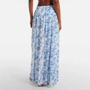 Detail of high waist maxi skirt with blue leaf print on white fabric and elastic waist