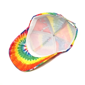 Detail view of the interior structure and reinforced seams of a rainbow tie-dye cap