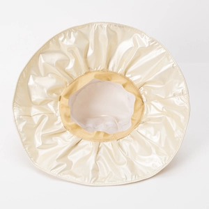 Women's UV protection sun hat with wide brim in champagne gold shiny fabric