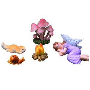 5-piece miniature garden set with a sleeping fairy, squirrel, snail, mushrooms, and campfire
