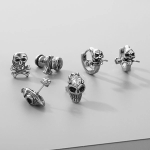 Gothic silver skull stud earrings set with vintage punk sword and rose details