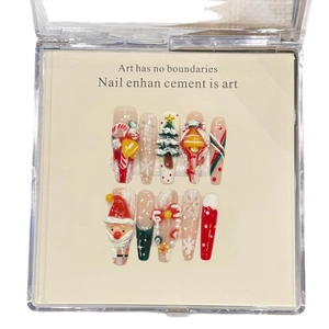 Handmade 3D Christmas press-on nails with Santa Claus and snowflake motifs on red tips