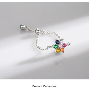 Macro detail of adjustable S925 silver chain ring with colorful zircon flower setting