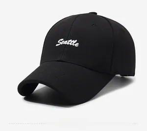 Detail showing the white 3D Seattle embroidery on the front of the black baseball cap