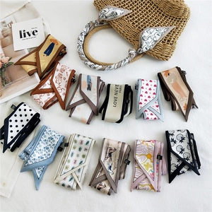 Collection of various printed skinny silk scarves for women neck and bag decoration