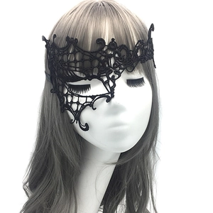 Close-up of black lace eye mask on model for masquerade parties and Halloween events