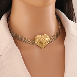 French style gold heart pendant necklace in stainless steel on a professional model
