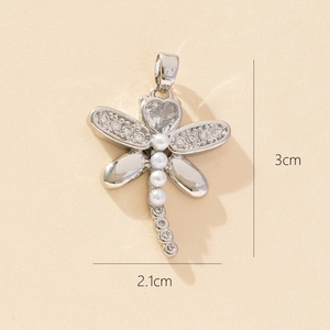 Detailed view of dragonfly pendant with dimensions of 3cm by 2.1cm and zircon stones