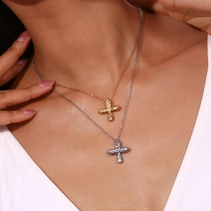 Classic 18K gold and silver plated hammered cross necklaces on a fashion model