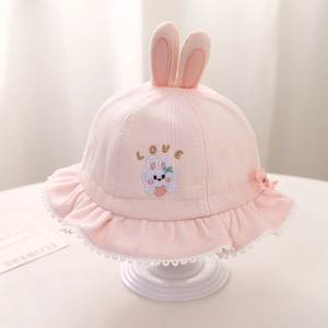 Detail of pink cotton baby sun hat featuring rabbit ears, love embroidery and lace brim