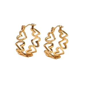 Detailed view of hollow heart-shaped gold titanium steel earrings on a clean white backdrop