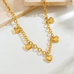 Elegant gold-plated stainless steel chunky chain necklace featuring five heart pendants