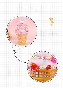 Close-up of DIY ice cream night light with pink cream glue and unicorn accessories