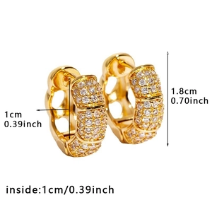 Macro shot of gold hoop earring with white cubic zirconia and 1.8cm height dimension