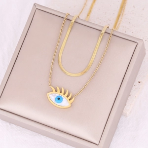 Double-layer gold stainless steel evil eye pendant necklace on premium jewelry display