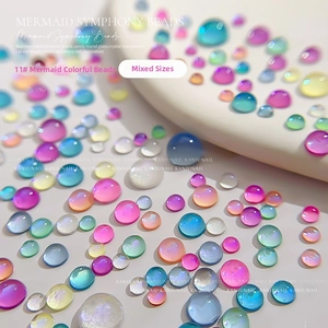 Macro shot of 11# macaron mermaid pearls in mixed sizes for nail art decoration