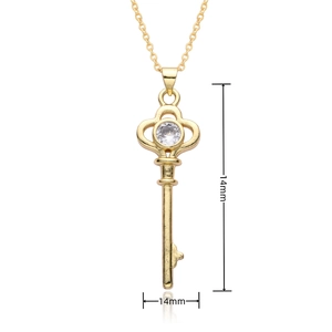 Detail view of 14mm heart key pendant in 18k gold finish with sparkling zircon stone
