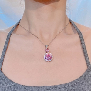Elegant round pink zircon pendant necklace with white diamond halo on a silver chain