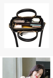 Detail of a large capacity black tote bag interior showing multi-compartment storage space