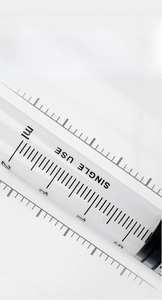 Macro shot of 5ml disposable veterinary syringe showing clear black measurement scale