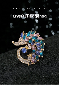 Detailed close-up of crystal hedgehog brooch featuring blue and purple marquise stones